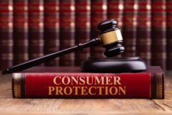 Consumer protection laws book with gavel regarding information on the Consumer Protection Act in Canada
