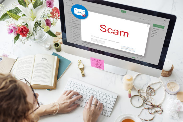 Woman receives scam alert on a computer