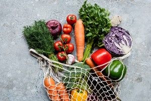 Vegetables in a mesh grocery bag