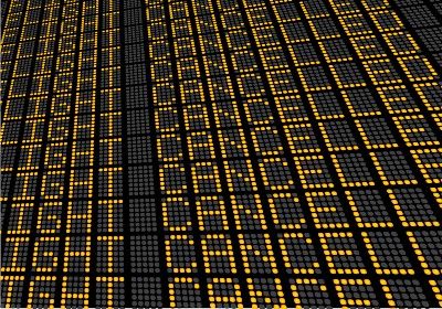 Flight status board shows rows of "flight cancelled"