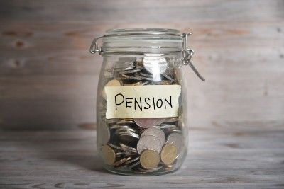 Jar full of coins with "pension" label - Avacade