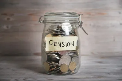 Jar full of coins with "pension" label - Avacade