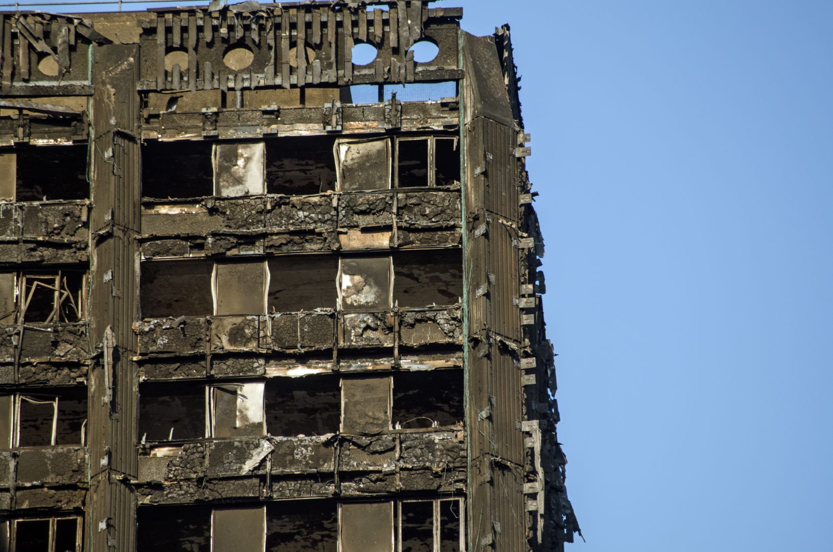 Burned corner of Grenfell Tower - cladding