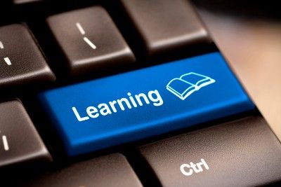 Blue "Learning" key on computer keyboard - tuition fee refunds