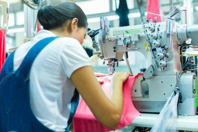 A seamstress works in a garment factory - leicester garment workers