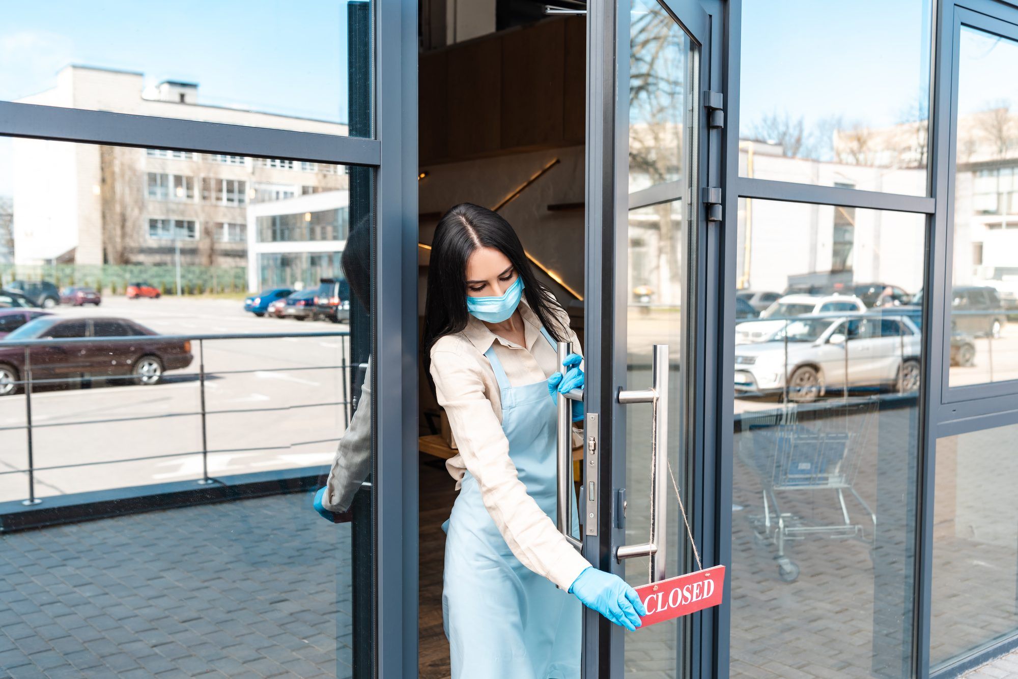 Woman closing business regarding the COVID-19 Furlough Scheme extension 