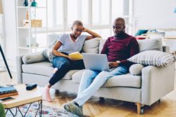 Couple working at home regarding the Furlough scheme extended amid COVID-19 
