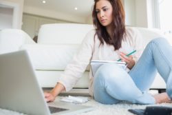 Woman paying bills regarding the rules enacted regulating bills amid COVID