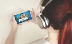 Girl playing fortnite regarding the Epic Games legal action in UK