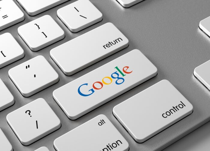 A keyboard with a button Google