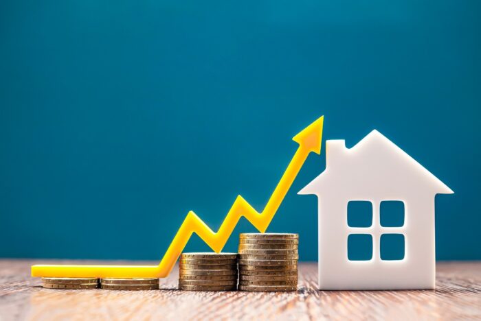 Real estate market, graph, up arrow.