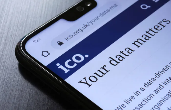 The Information Commissioner's Office ICO website seen on the smartphone corner.