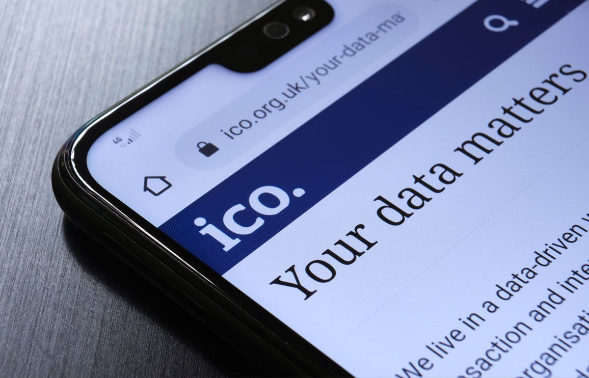 The Information Commissioner's Office ICO website seen on the smartphone corner.