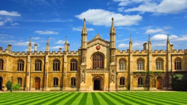 University in Cambridge with a beautiful lawn under a blue sky on a sunny day in summer.