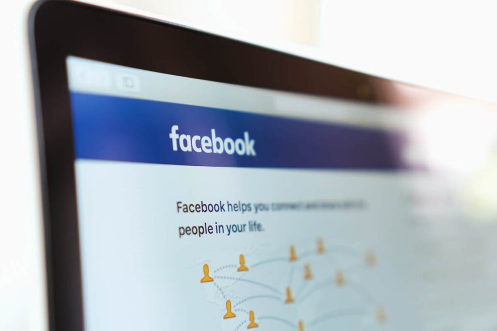 Close up of the Facebook landing page on a laptop screen.