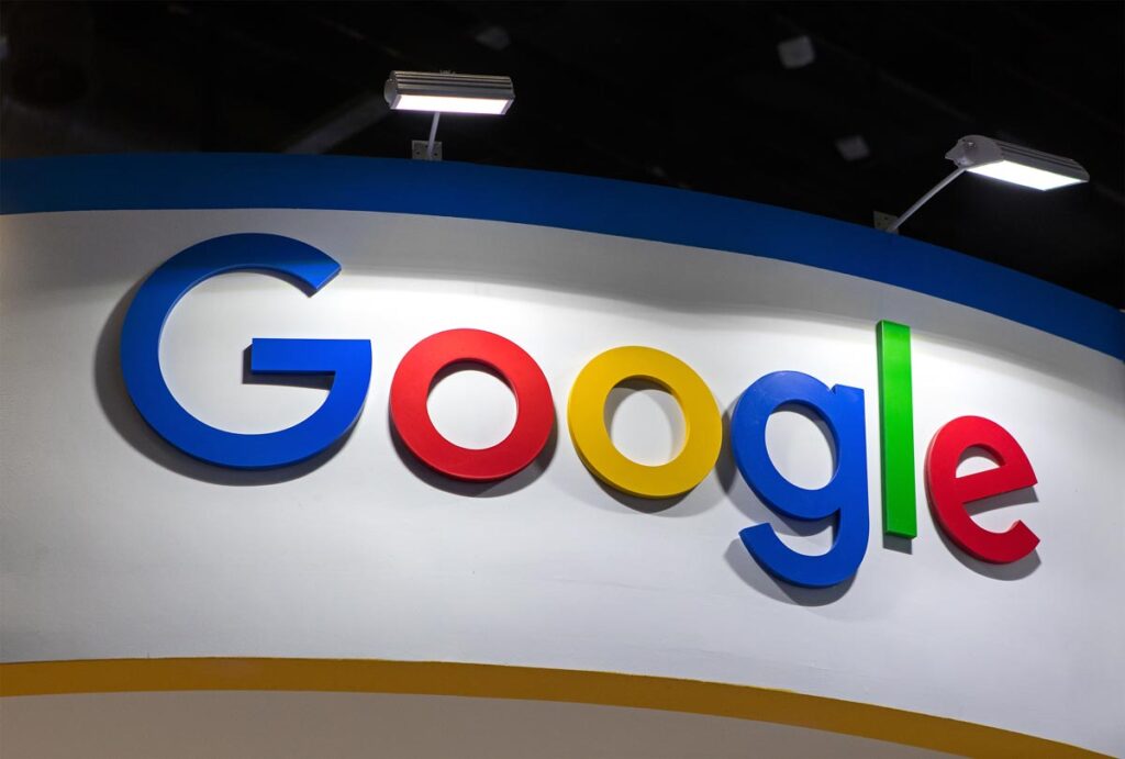 Close up of a Google logo on a wall, representing the Google antitrust accusations.