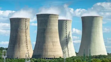 Cooling towers at a nuclear power plant, representing the Westinghouse antitrust investigation.