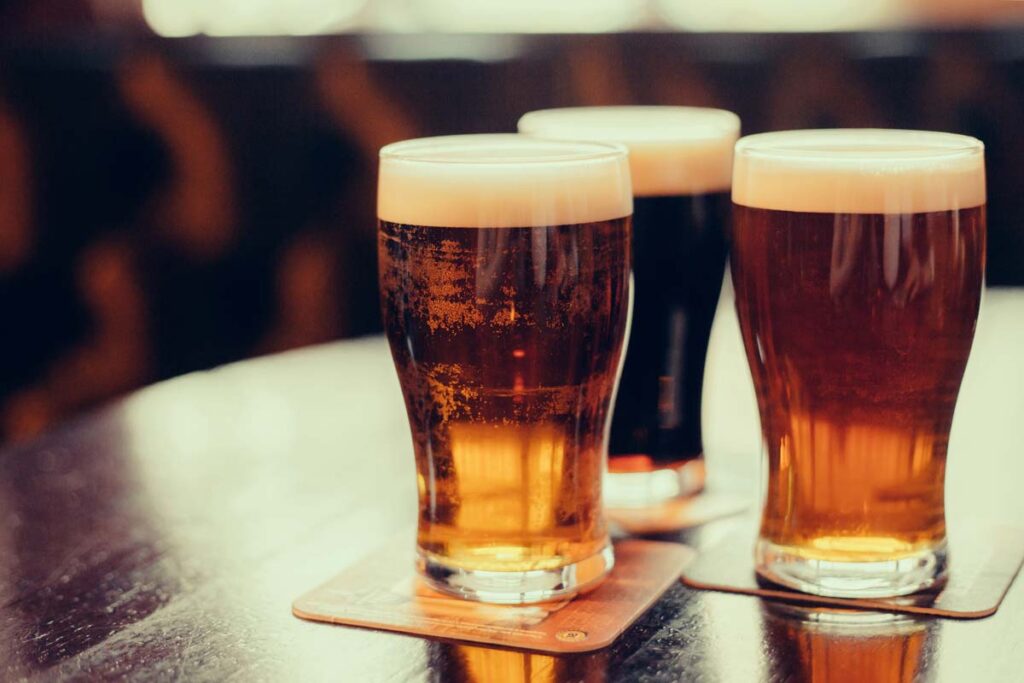 Close up of beer in glasses, representing pub prices.