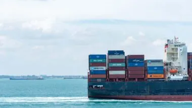 CSAV container cargo ship at sea, representing the motorists class action settlement.