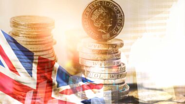 UK flag and currency, representing the Britain minimum wage hike.