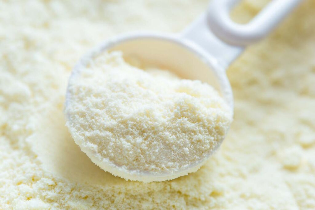 Close up of infant powder formula and a spoon, representing the Nutramigen infant formula recall.