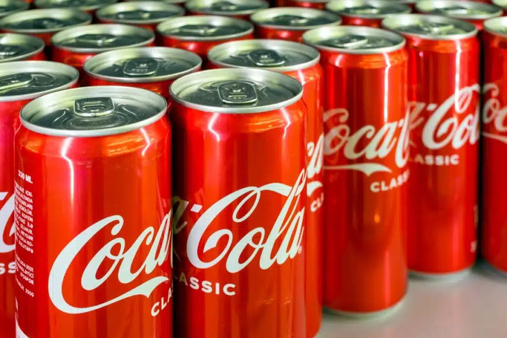 Close up of Coca-Cola cans, representing the Coca-Cola recall.