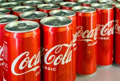 Close up of Coca-Cola cans, representing the Coca-Cola recall.